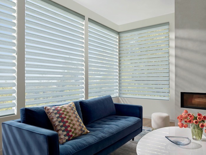 A living room with furnishings in shades of blue.